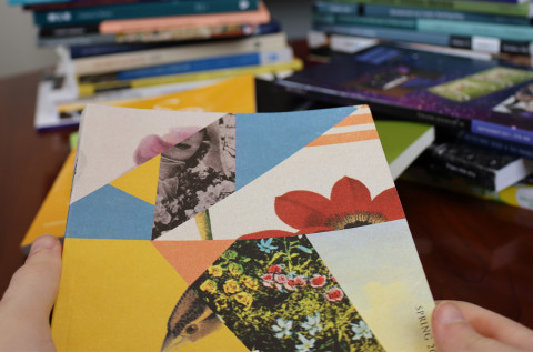 modern drama research paper topics Hands holding a journal with more journals stacked in the background.