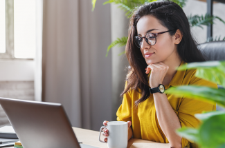 women at laptop at home