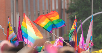 Pride parade, with focus on rainbow pride flag 