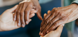 two hands holding each other