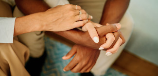 Hand crossing and coming together